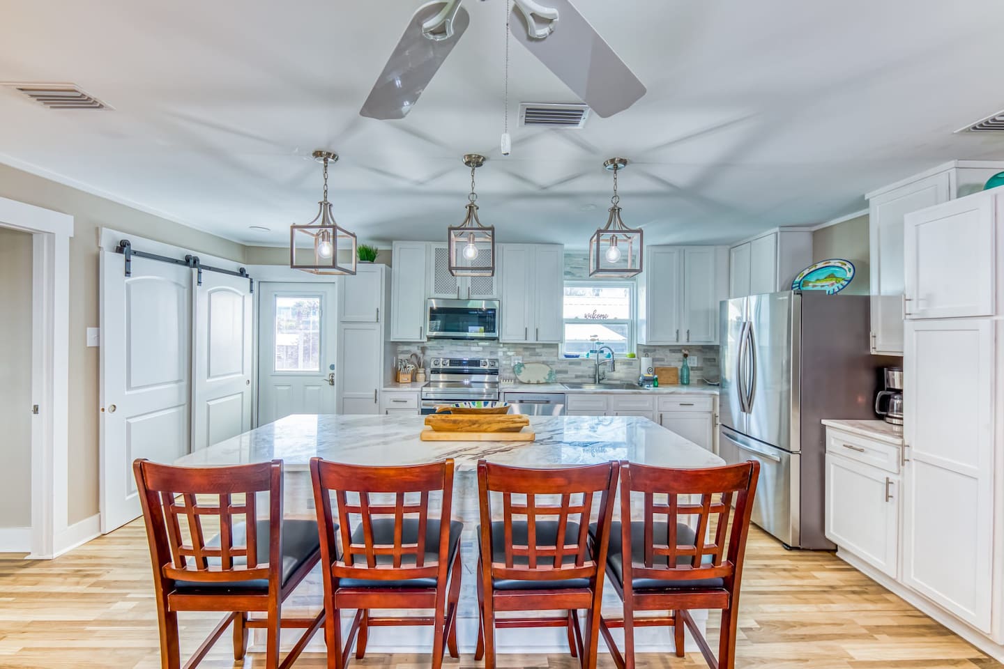Kitchen Oasis: Modern design with stylish lighting and a spacious island for culinary adventures!