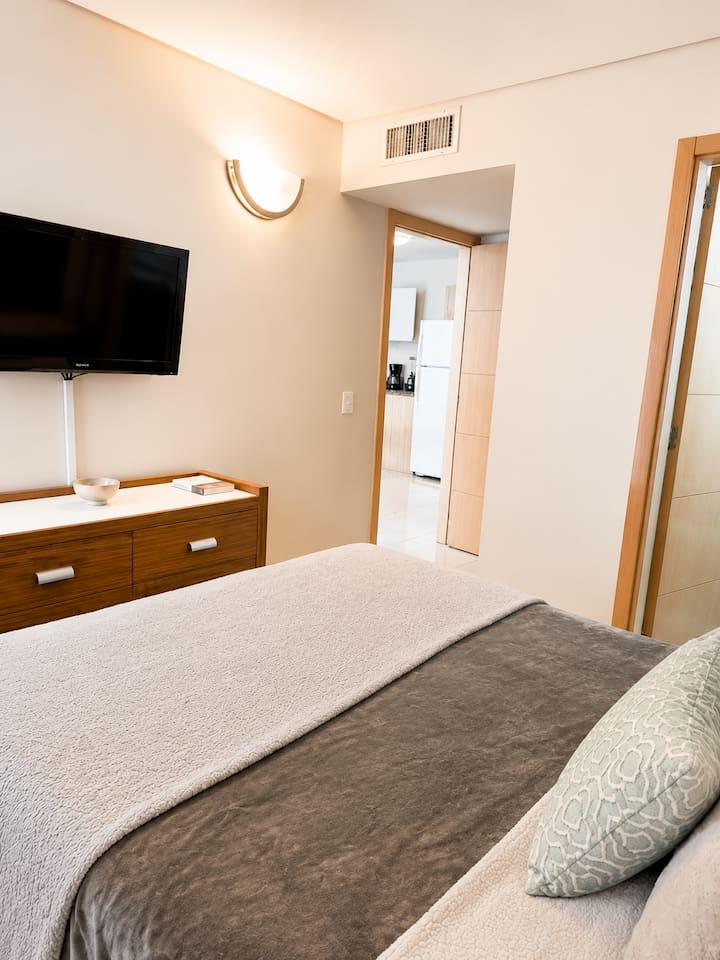 With plenty of storage and a TV, this room is perfect for both relaxation and convenience.