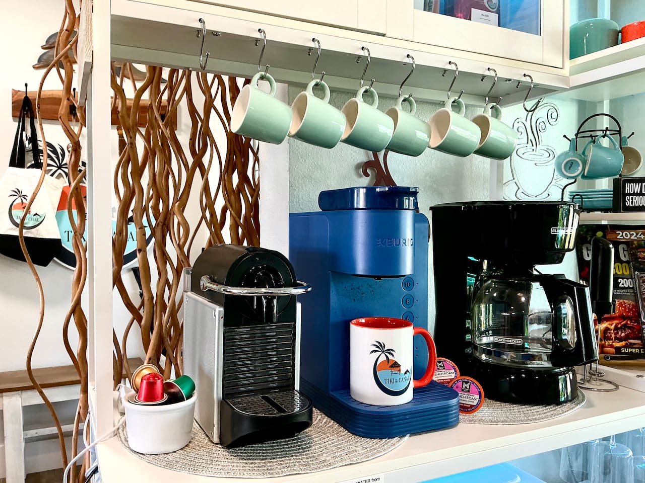 Coffee bar complete with everything you need, including a Nespresso maker with a few starter pods, a Keurig maker with pods, regular coffee maker, and much more! We also supply ground coffee and tea.