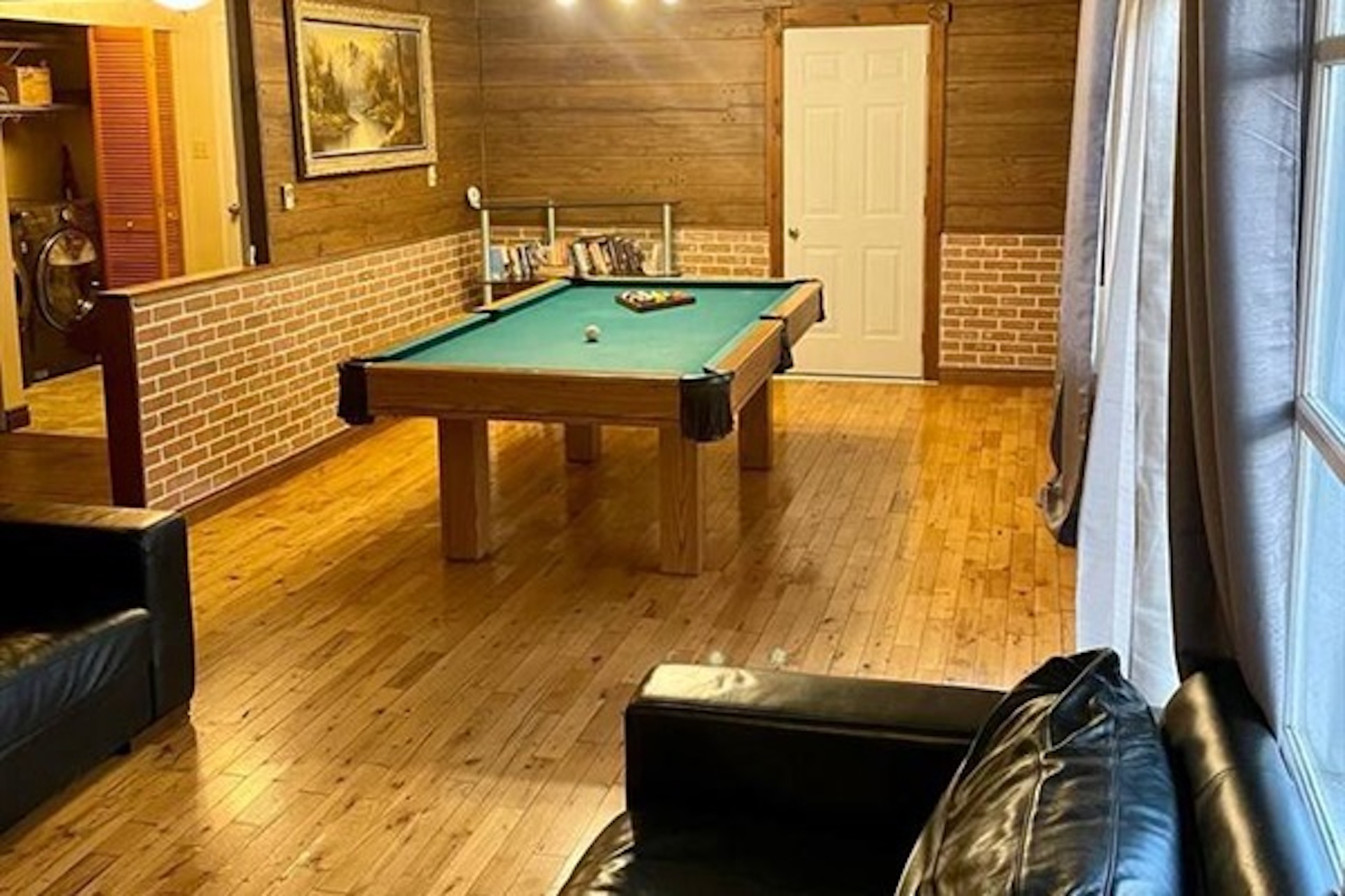 Recreation room with pool table and seating area