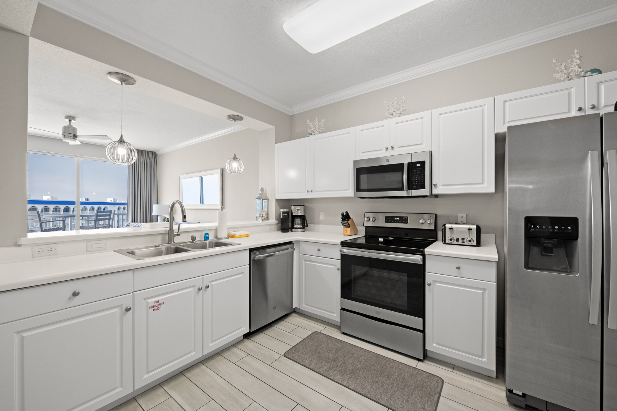 Bright kitchen w/ clean lines and plenty of counter space for easy meals.