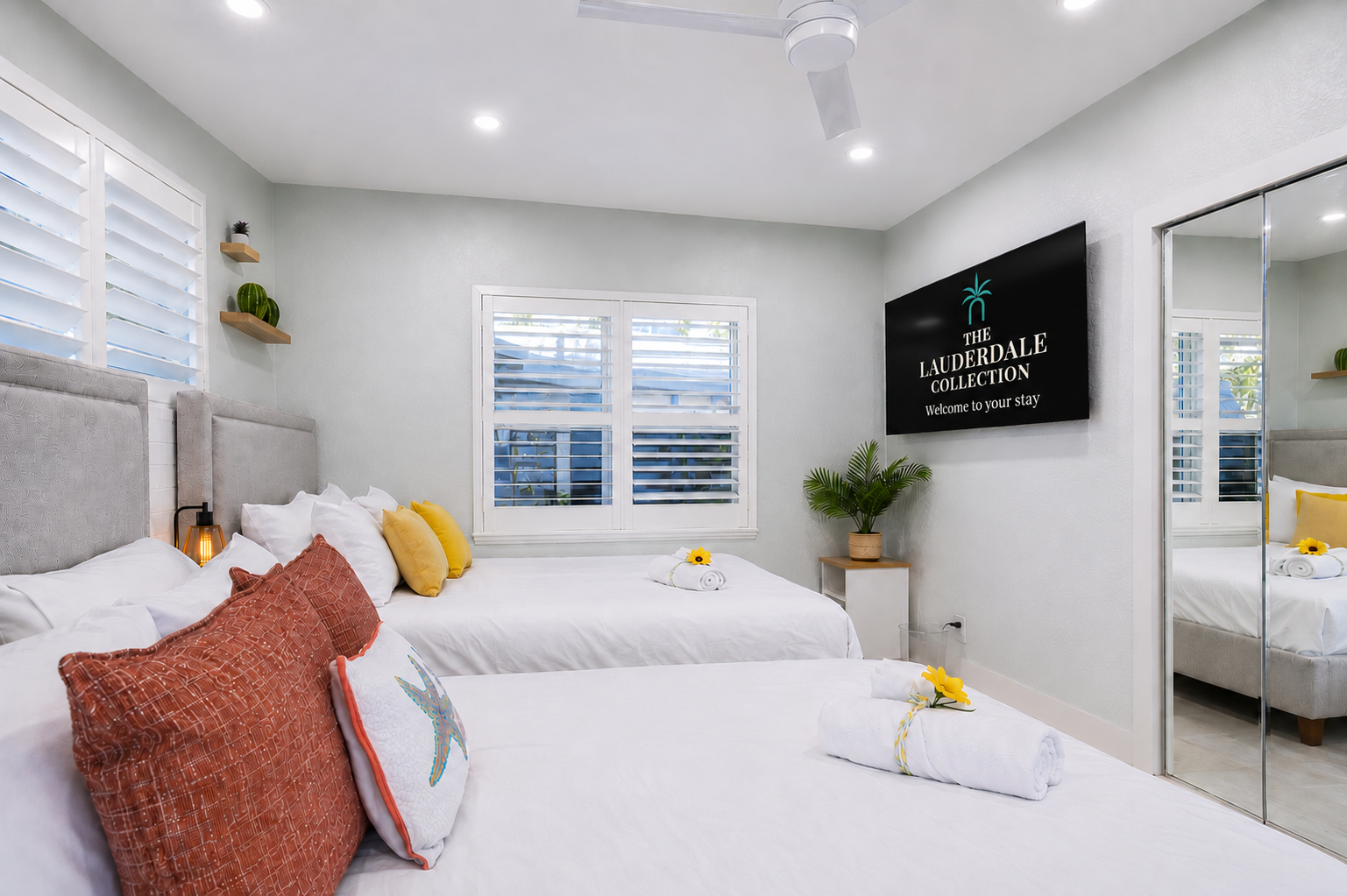 Two queen beds and straight out to the backyard — comfort meets fresh air 🌿- equipped w/ a Smart TV