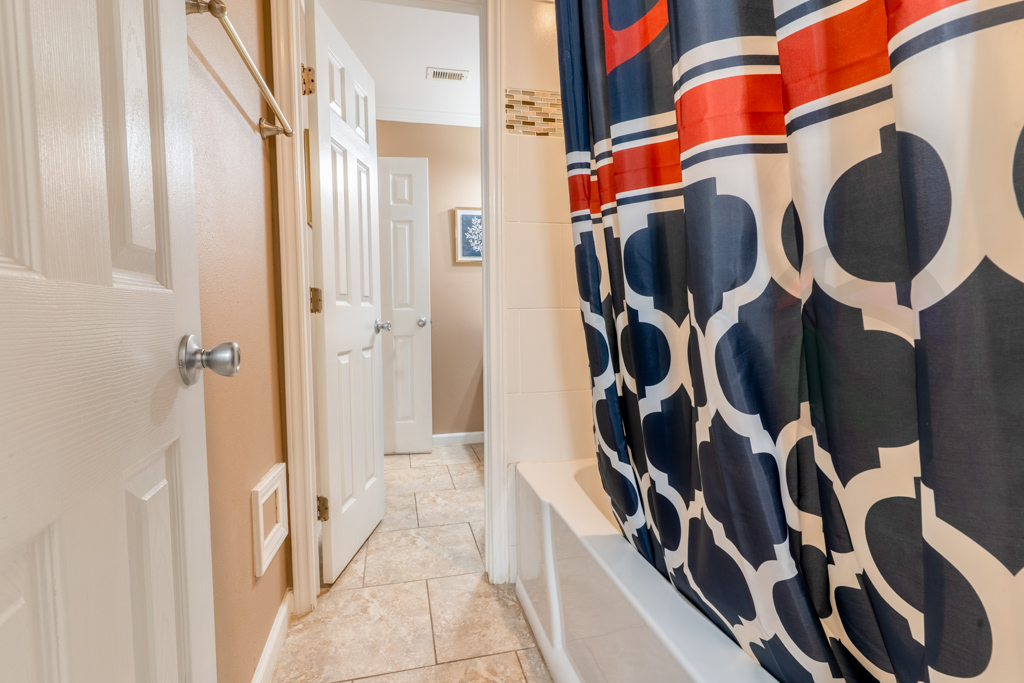 and a separate area with a tub/shower combination
