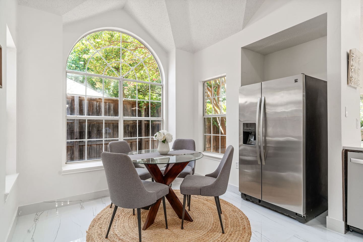Bright and modern kitchen nook adjacent to the kitchen with seating for four.