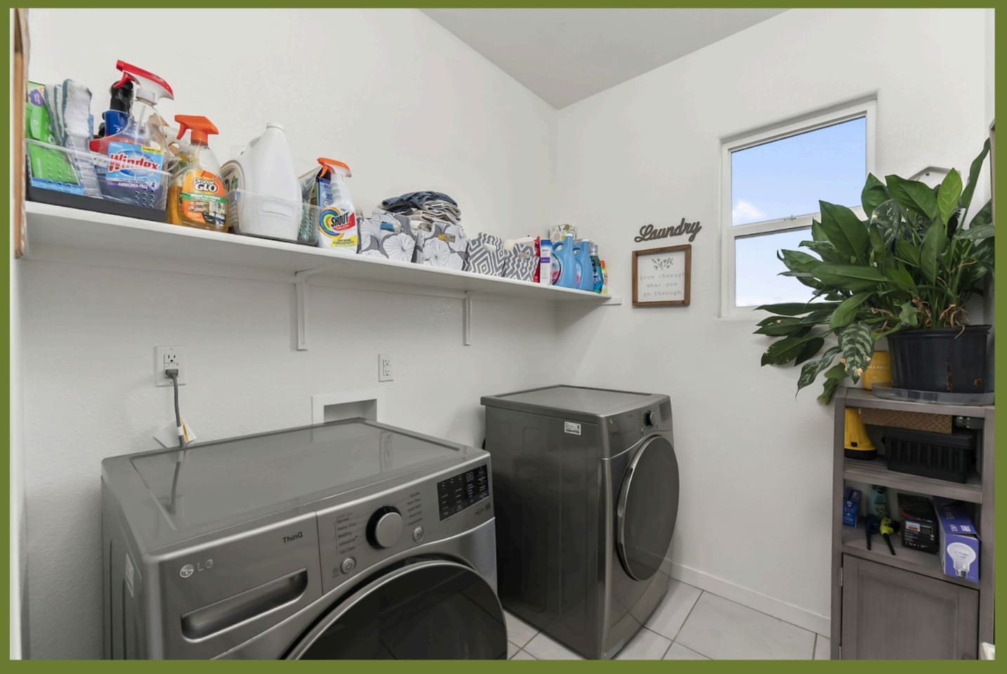 Laundry room withwasher and dryer, shelf storage for added convenience during your stay.