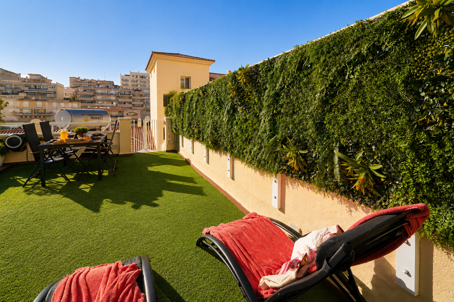 Stretch out on loungers or beanbags surrounded by lush greenery. A peaceful corner to read, nap, or soak up the Mediterranean sun in complete comfort and privacy.