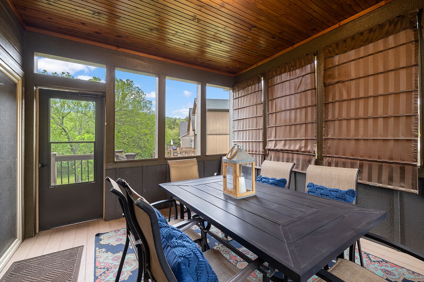 Main level deck with stairs down to lower level patio area with grill 