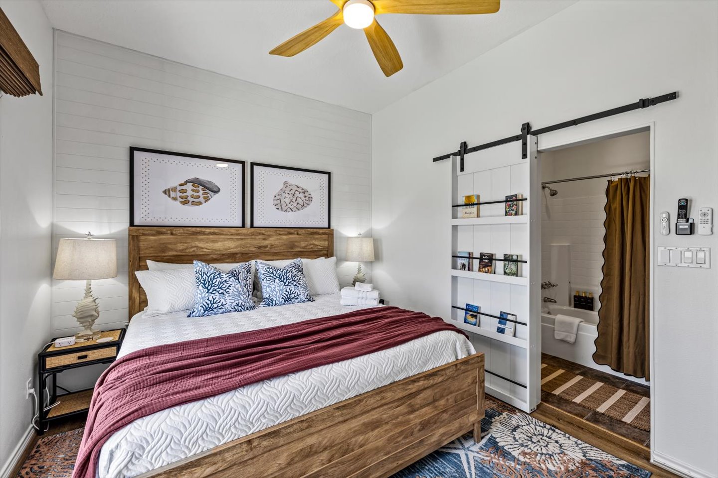 The Shell King bedroom on the main level with private bathroom. This primary suite is on the main floor for convenient access.