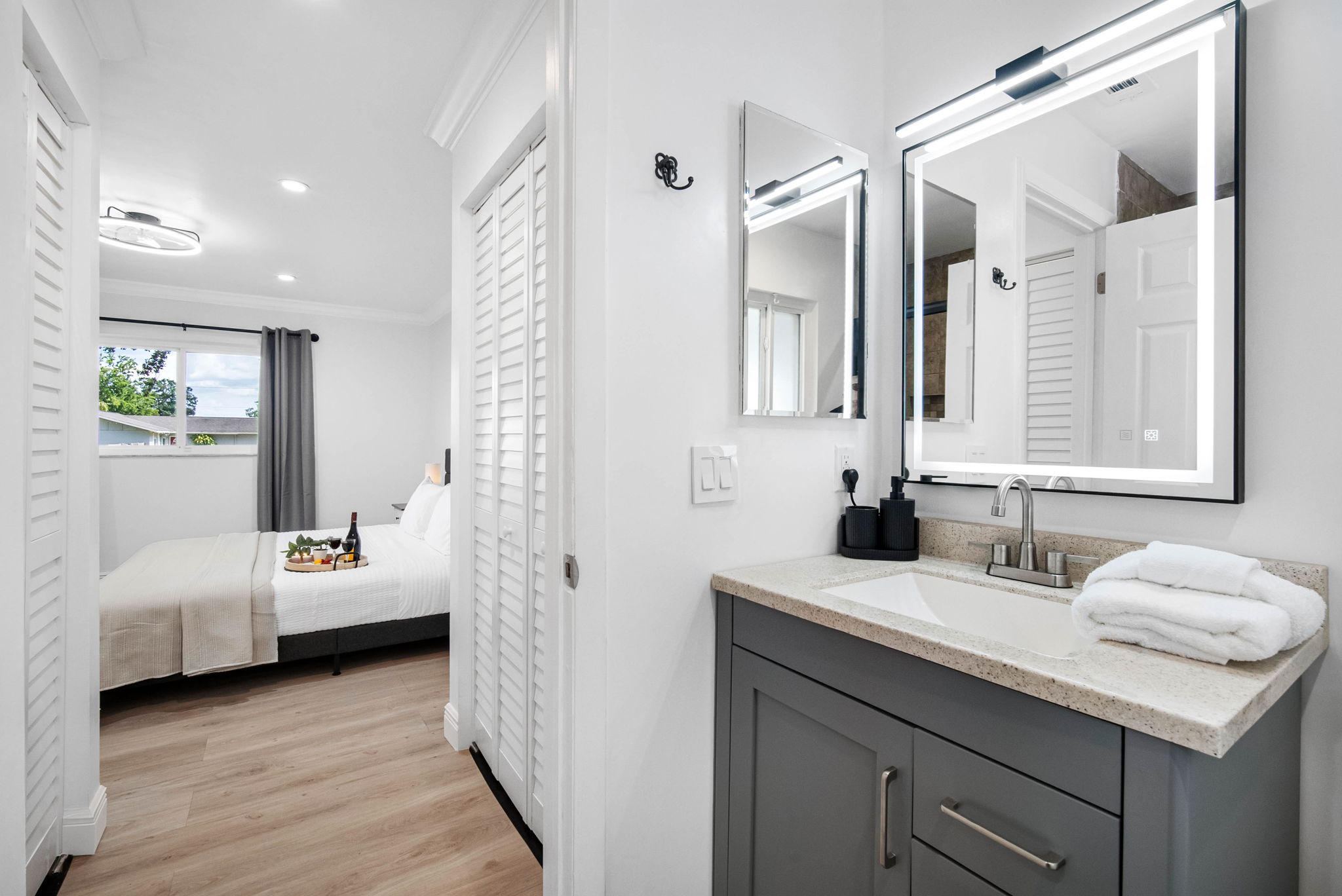 Wash the day away in a warm bath or quick shower—your retreat awaits behind sliding glass doors and warm tile accents.