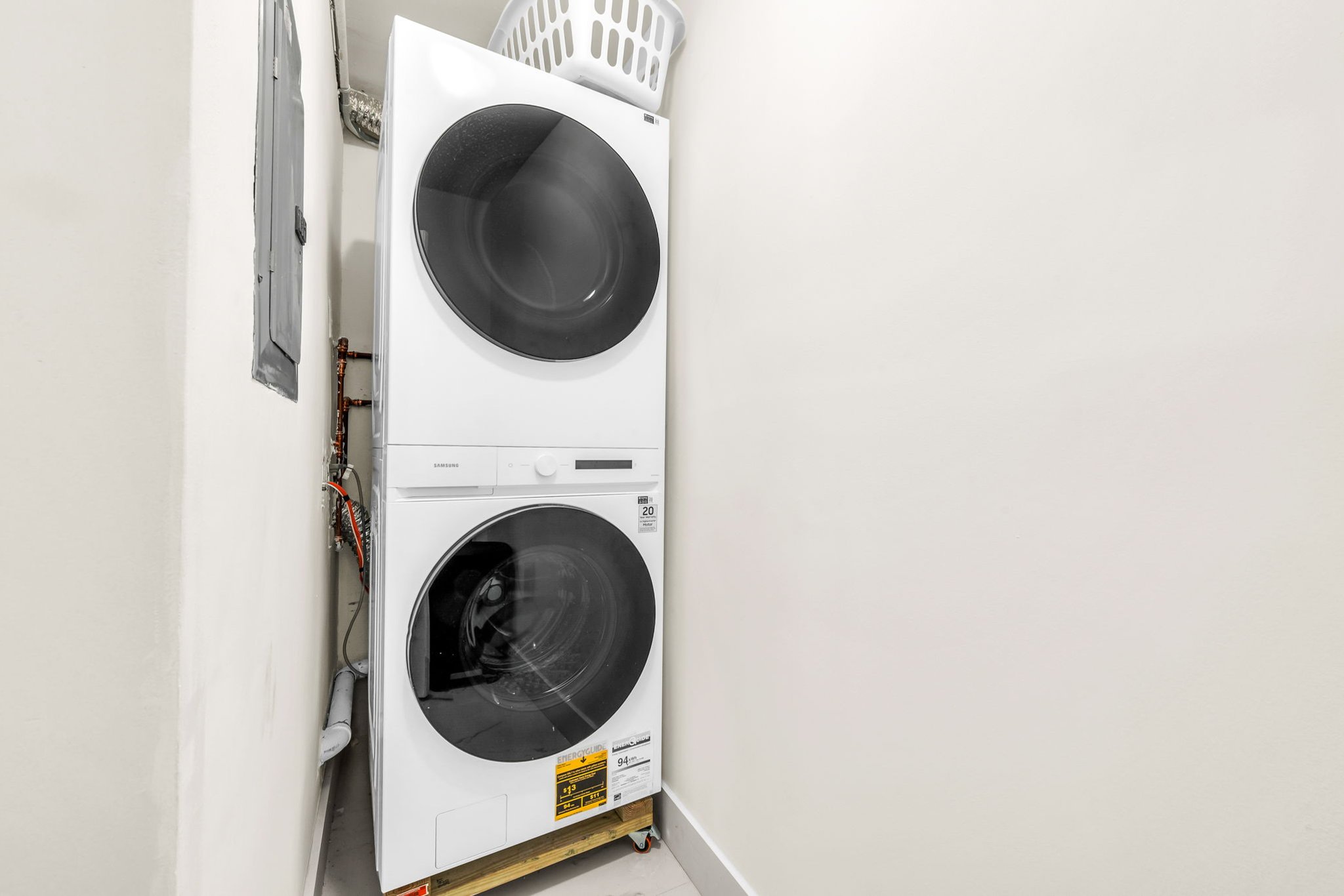 Stacked Samsung washer and dryer available for guest use—perfect for extended stays and pool days.