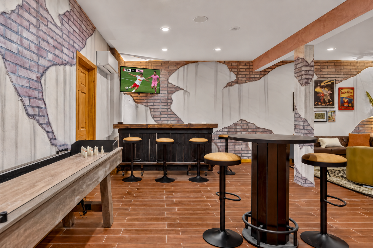 Shuffleboard table beside bar seating