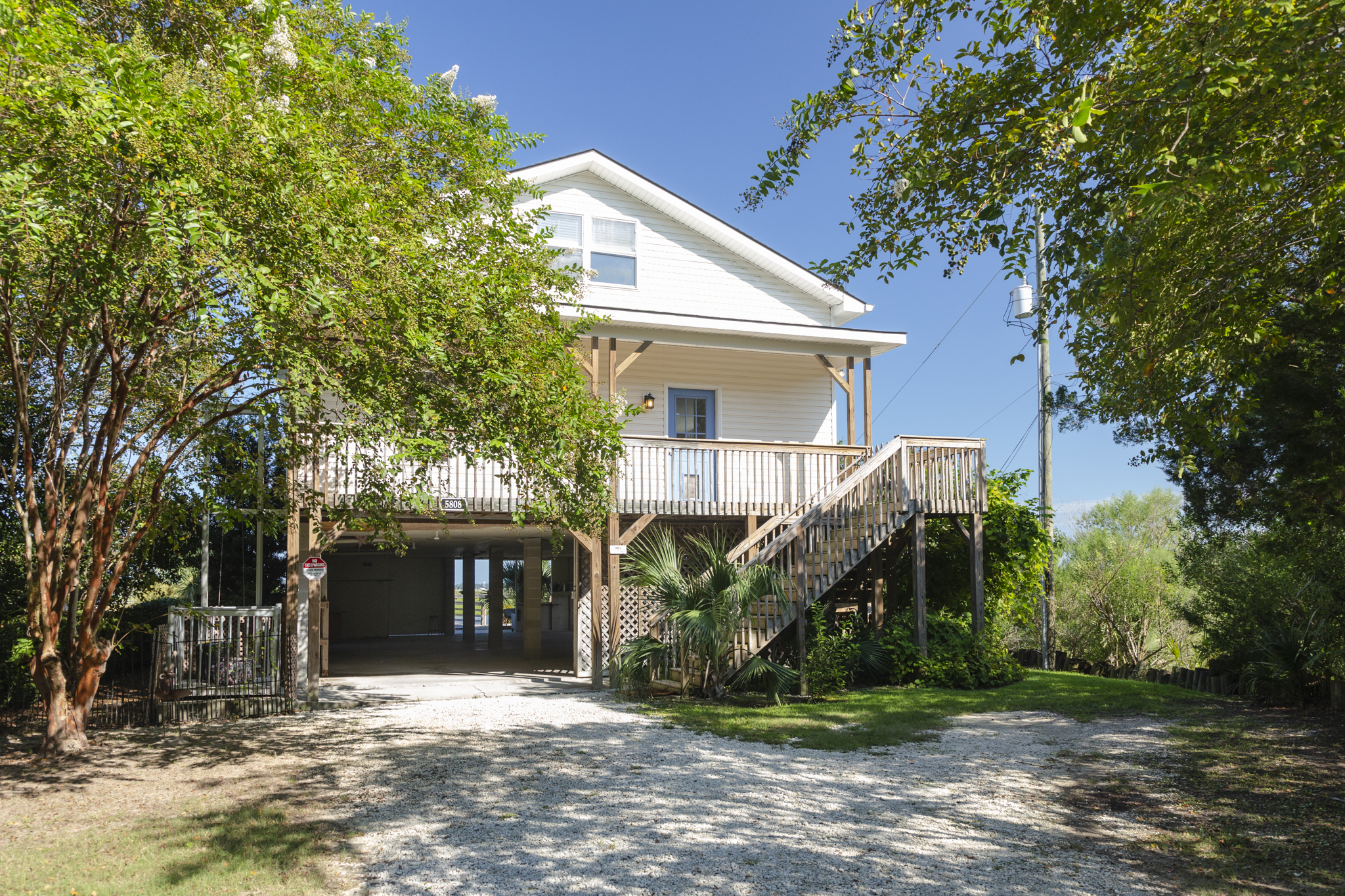 Elevated coastal design with convenient covered parking below the home.