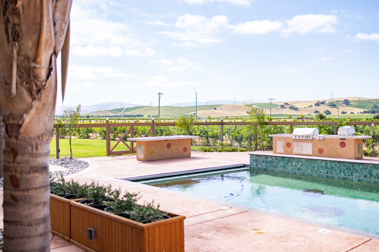 Our new pool, BBQ, fire table, and gazebo. Stay tuned for furnishings!