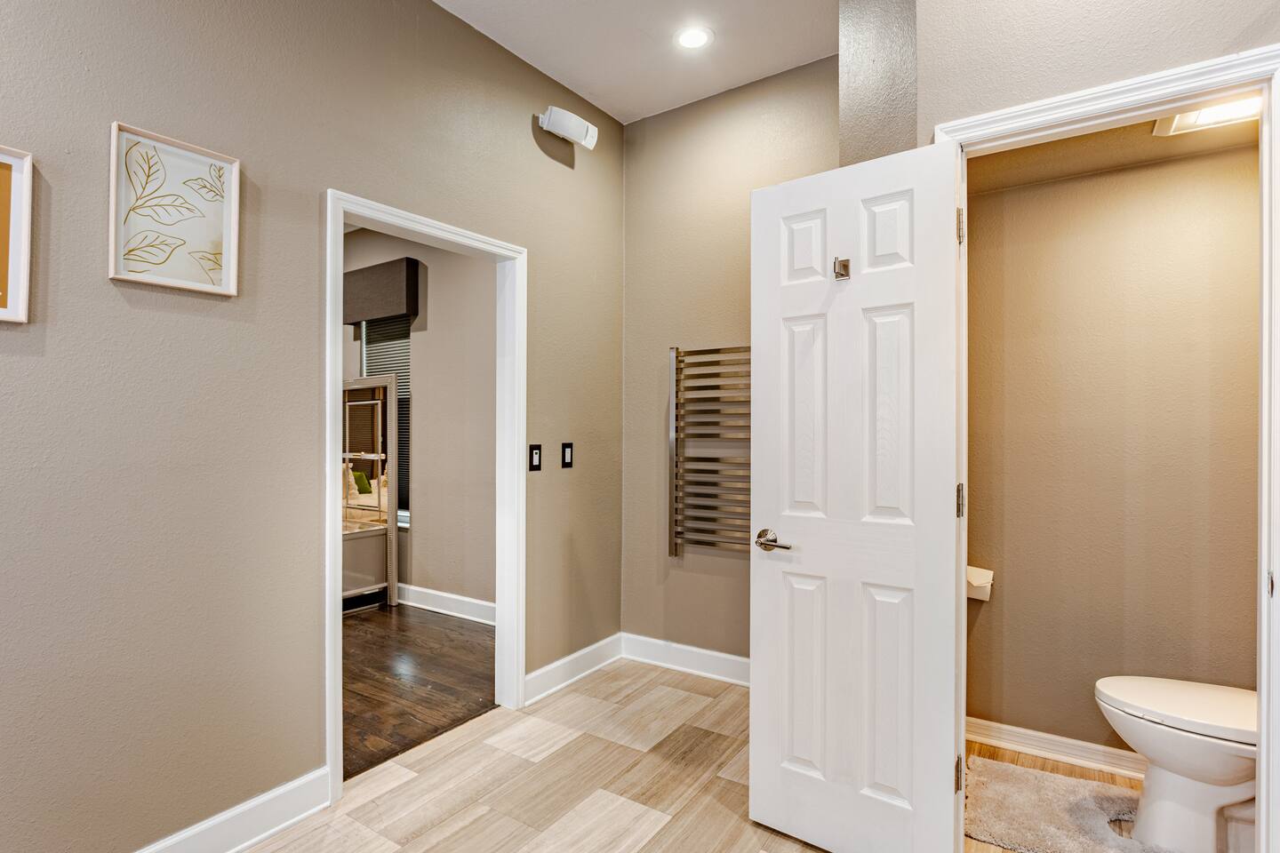 Indulge in a luxurious master bathroom featuring a spacious walk-in shower, sophisticated finishes, ample room to unwind, and elegant details that create a serene, spa-like retreat.
