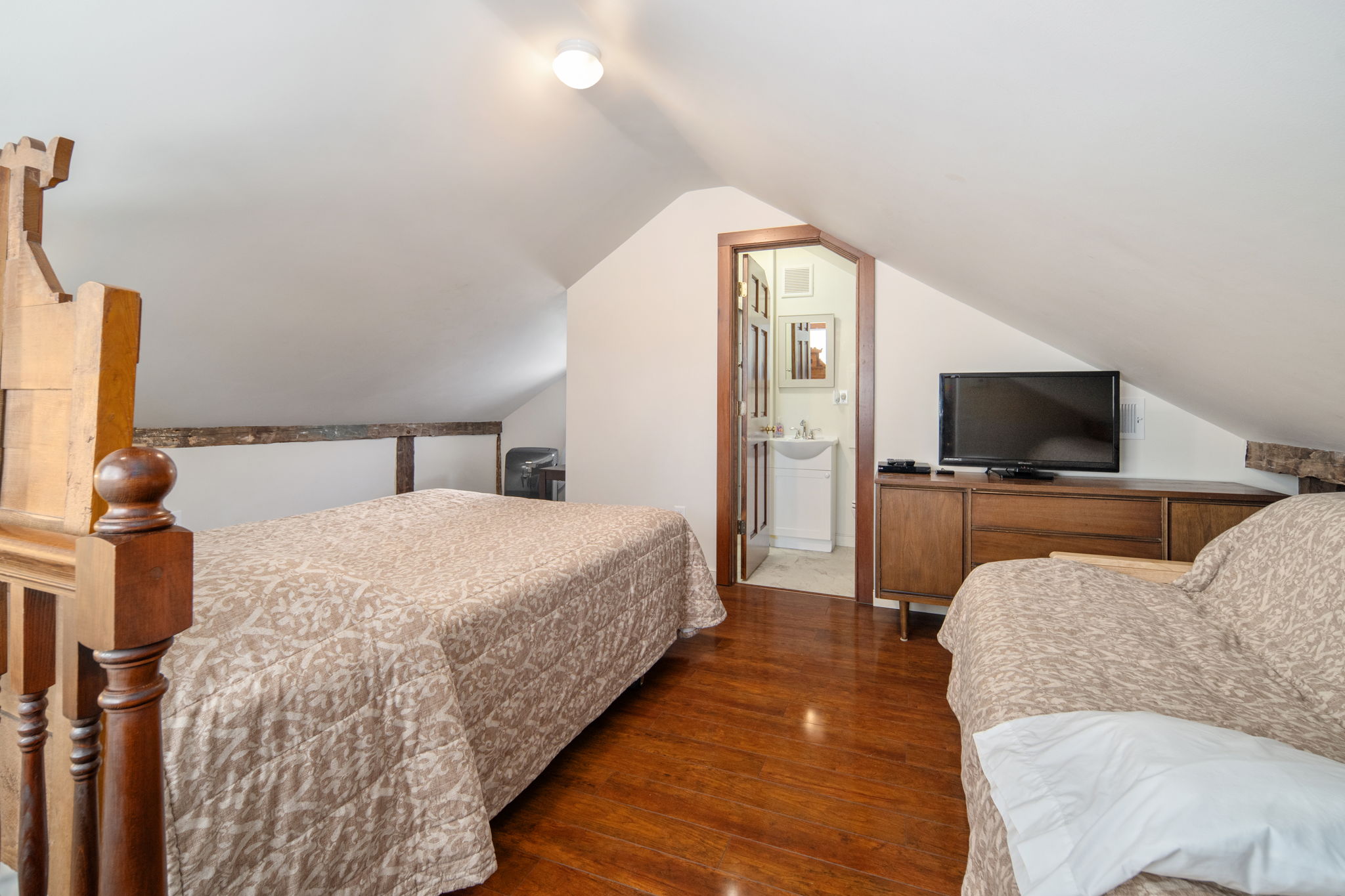 Relax upstairs with a bedroom TV and additional seating.