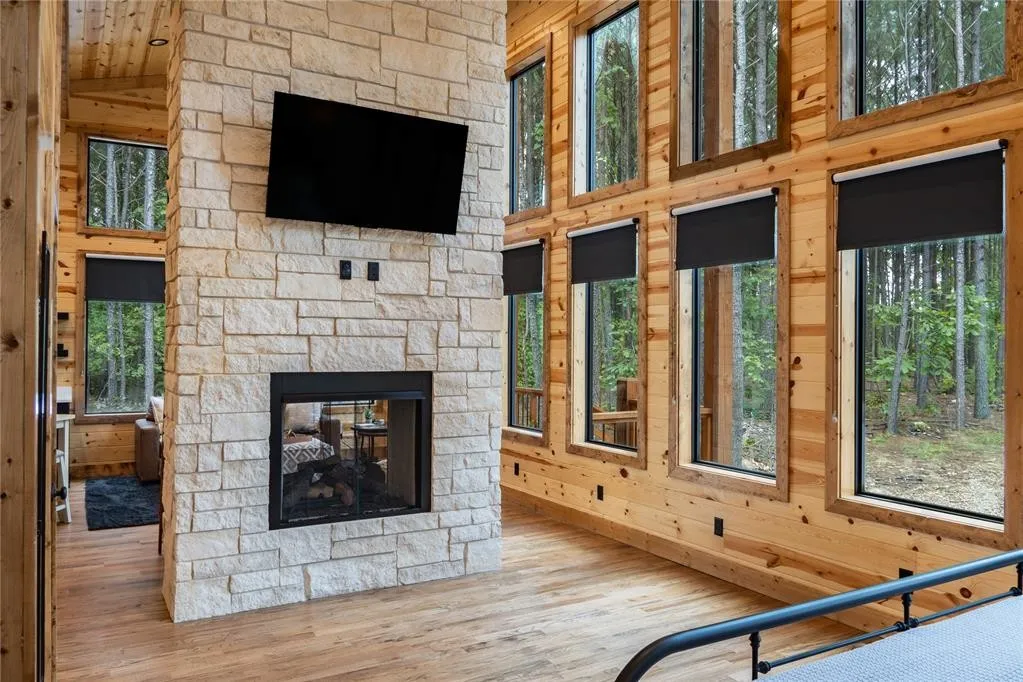 Floor to ceiling double fireplace.