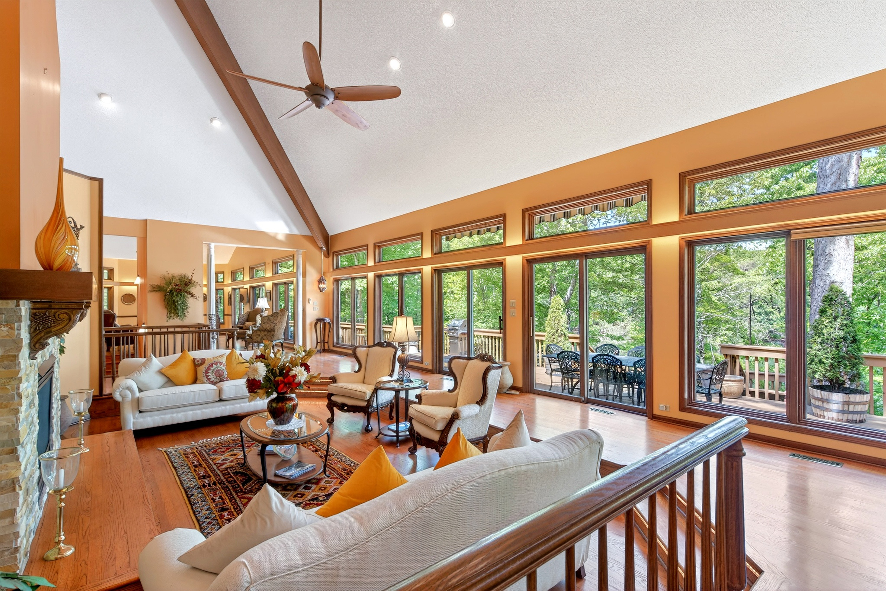 Vaulted ceilings and large windows make the living room bright and cheery