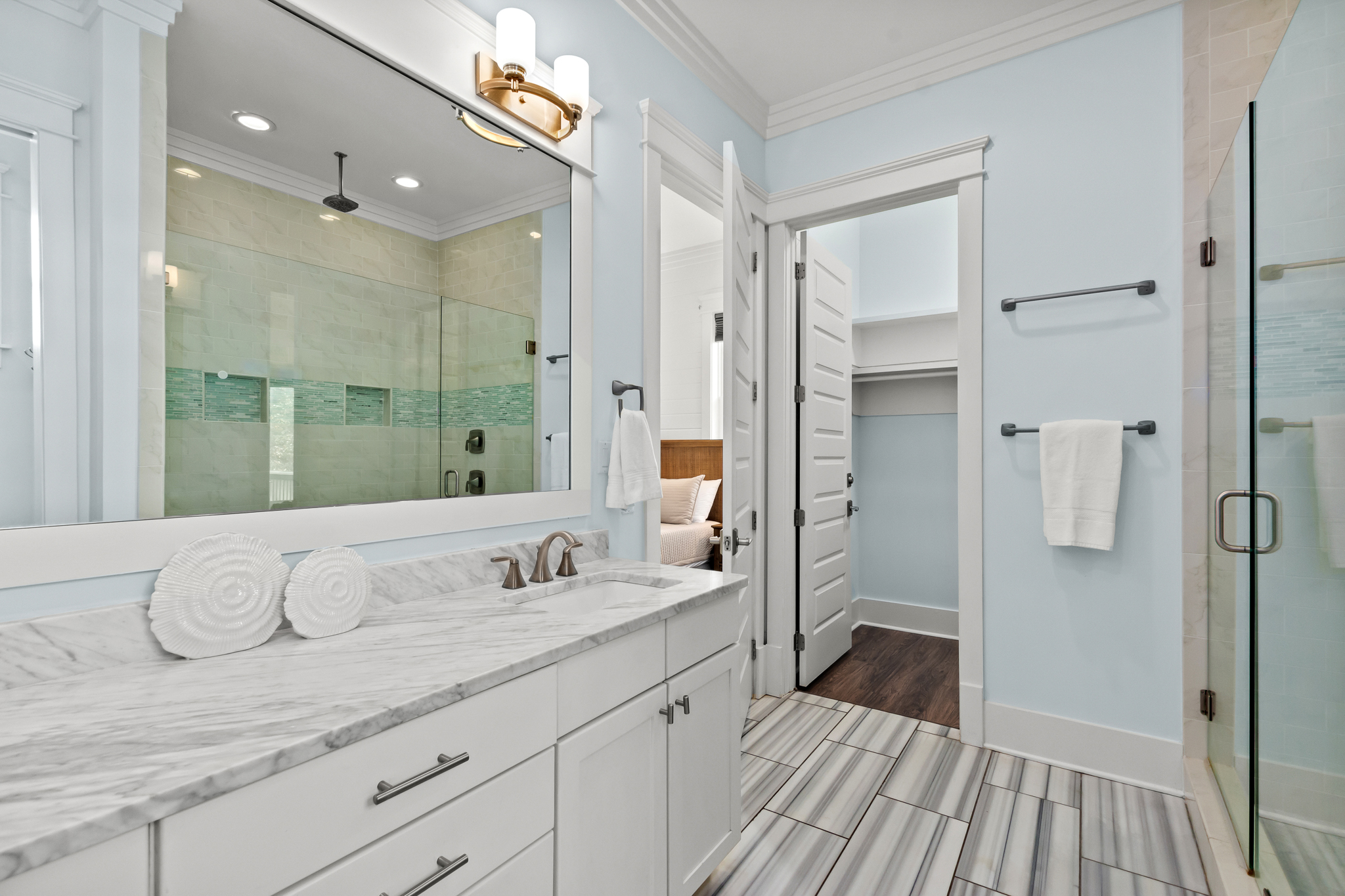 This spacious master bathroom gives you plenty of room to spread out and make yourself at home.