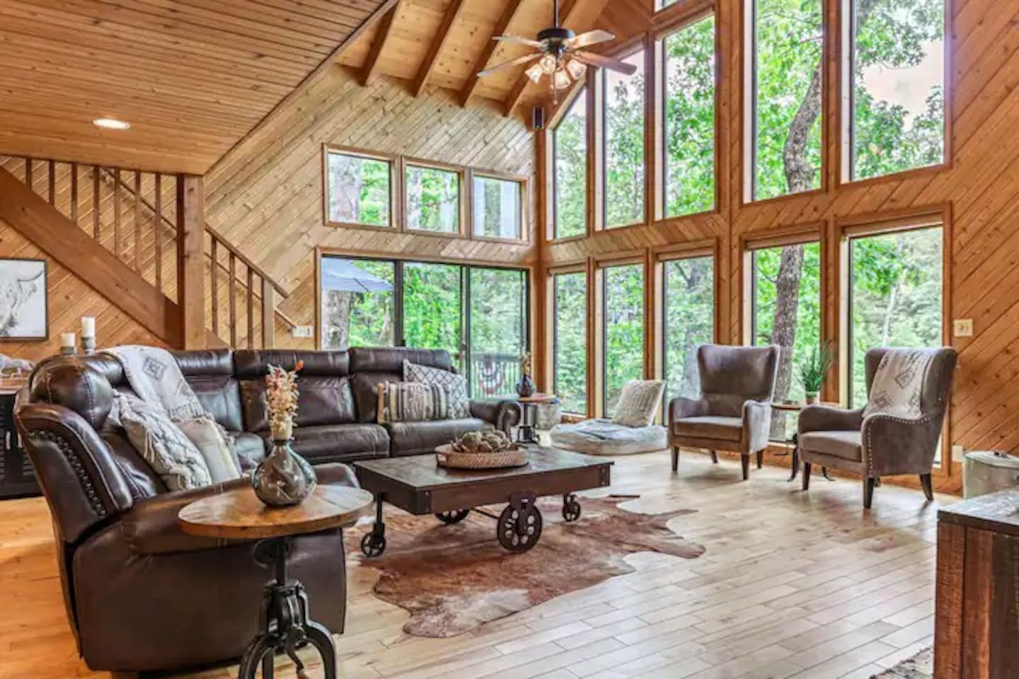 Open-concept living space perfect for gathering. Four serrate recliners for your relaxation.