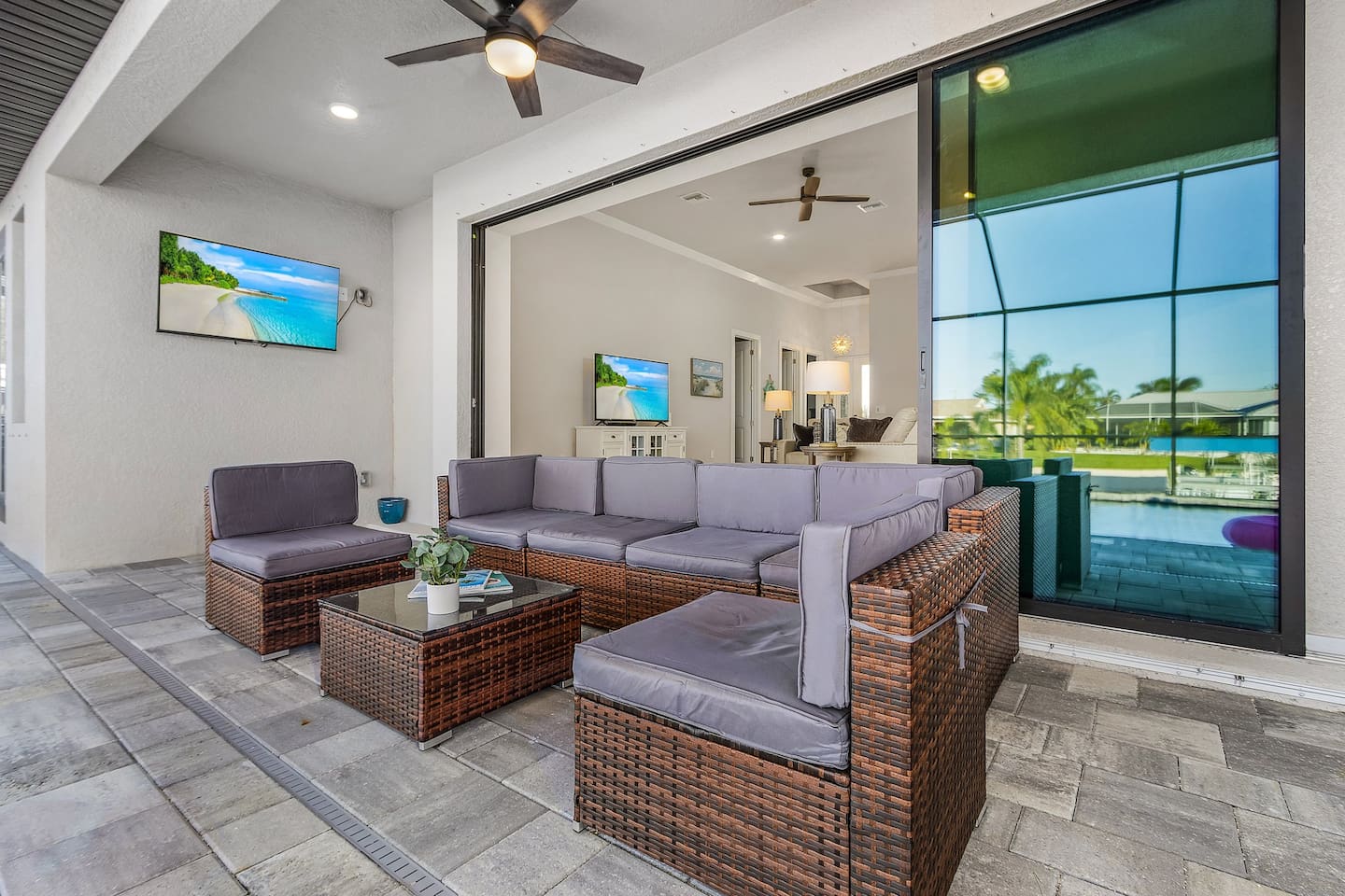 Enjoy Florida outdoor living with comfortable seating and an outdoor TV.