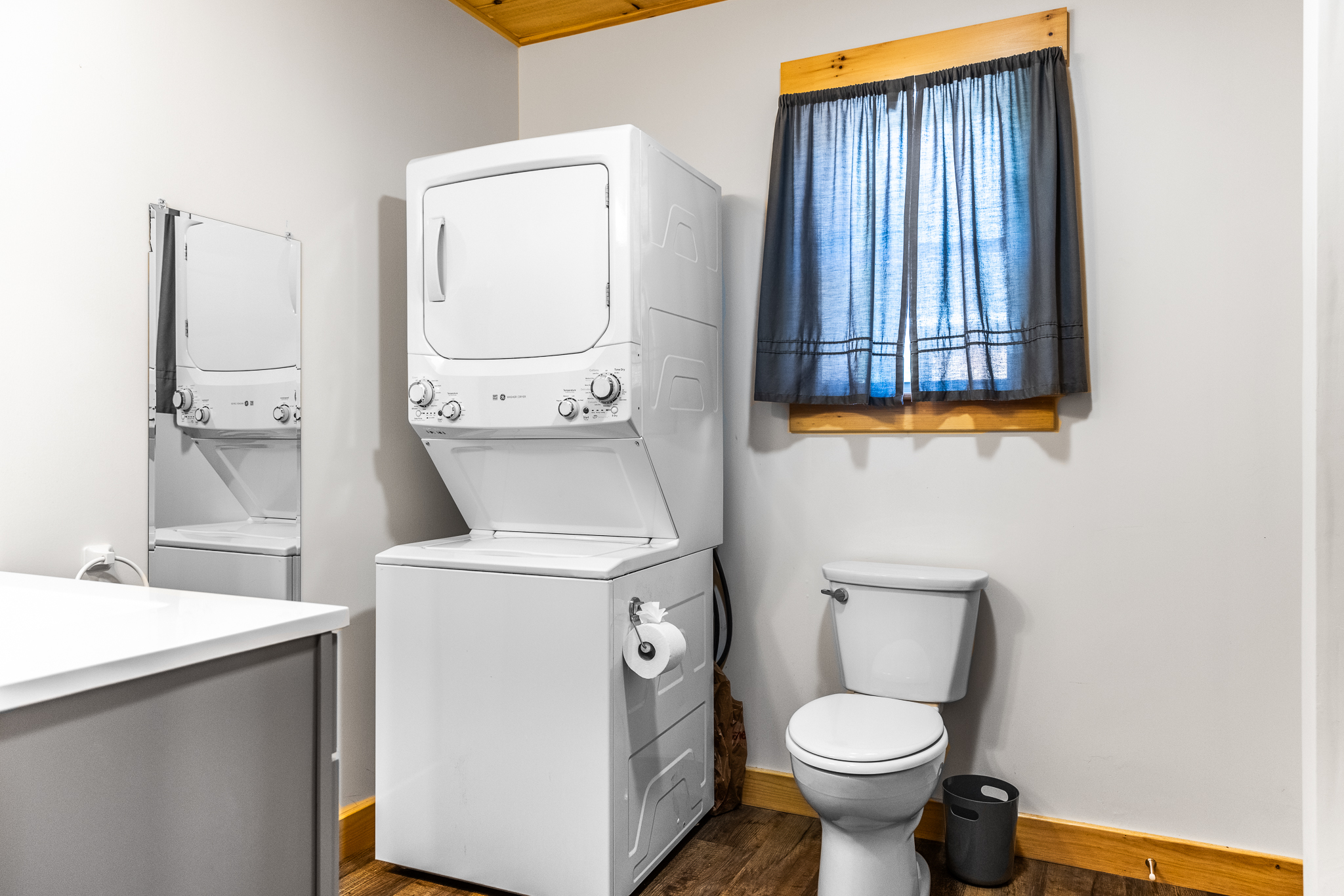 Full bathroom with washer and dryer