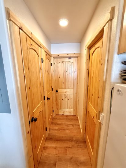 Hallway leading to bathroom, bedroom area.
