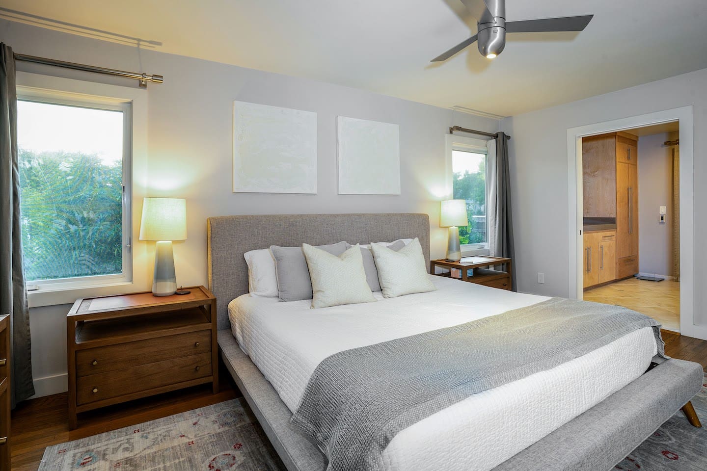 Primary bedroom with king bed and smart tv.