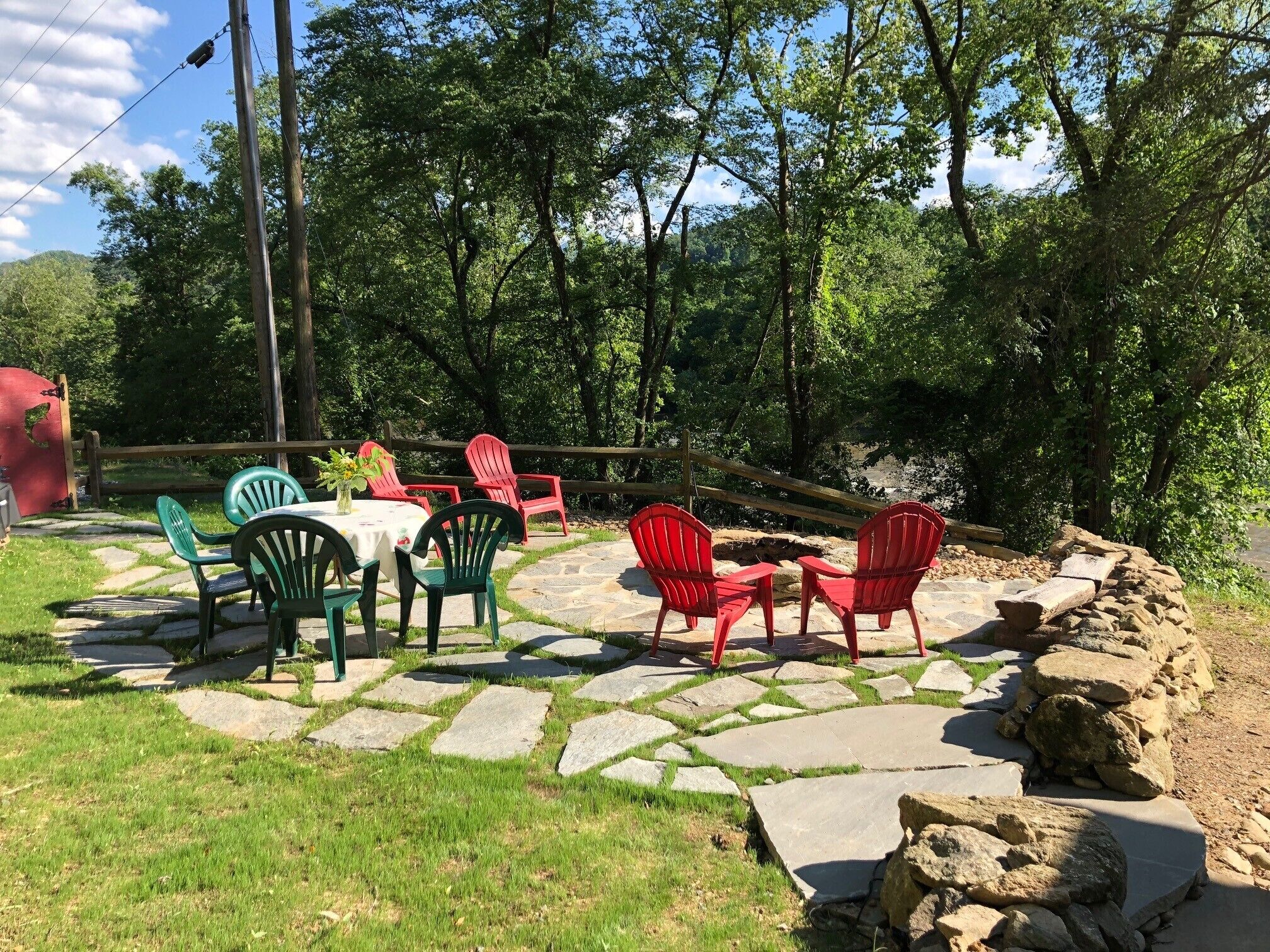 Enjoy outdoor dining by the river near the firepit, listening to the river music