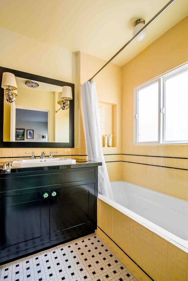 Full bathroom with tub/shower combo.