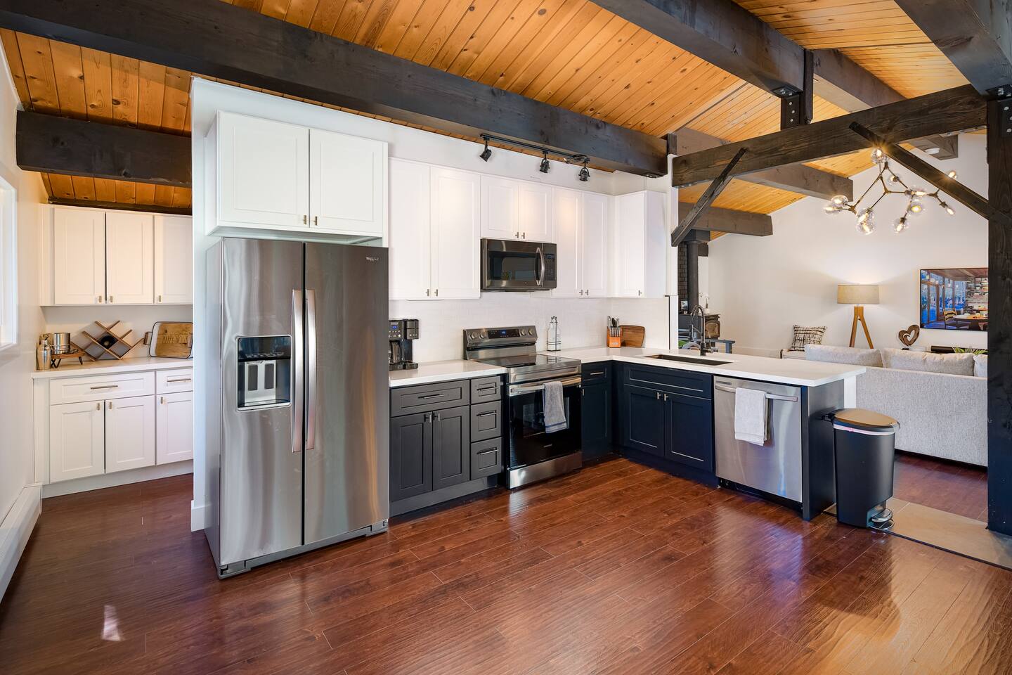  A Chef’s Dream Kitchen – Modern black-and-white cabinetry, stainless steel appliances, and a spacious layout make this kitchen a pleasure to cook in.