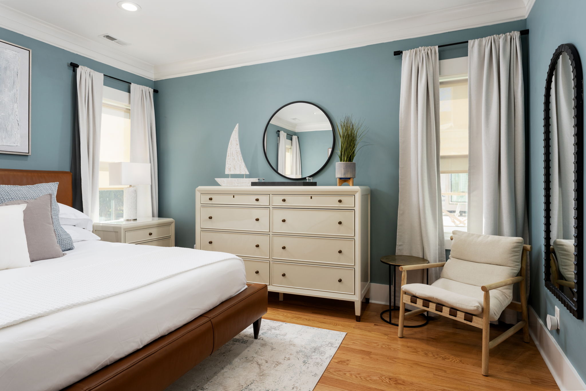 Thoughtfully designed primary suite with ample storage and a cozy seating nook.
