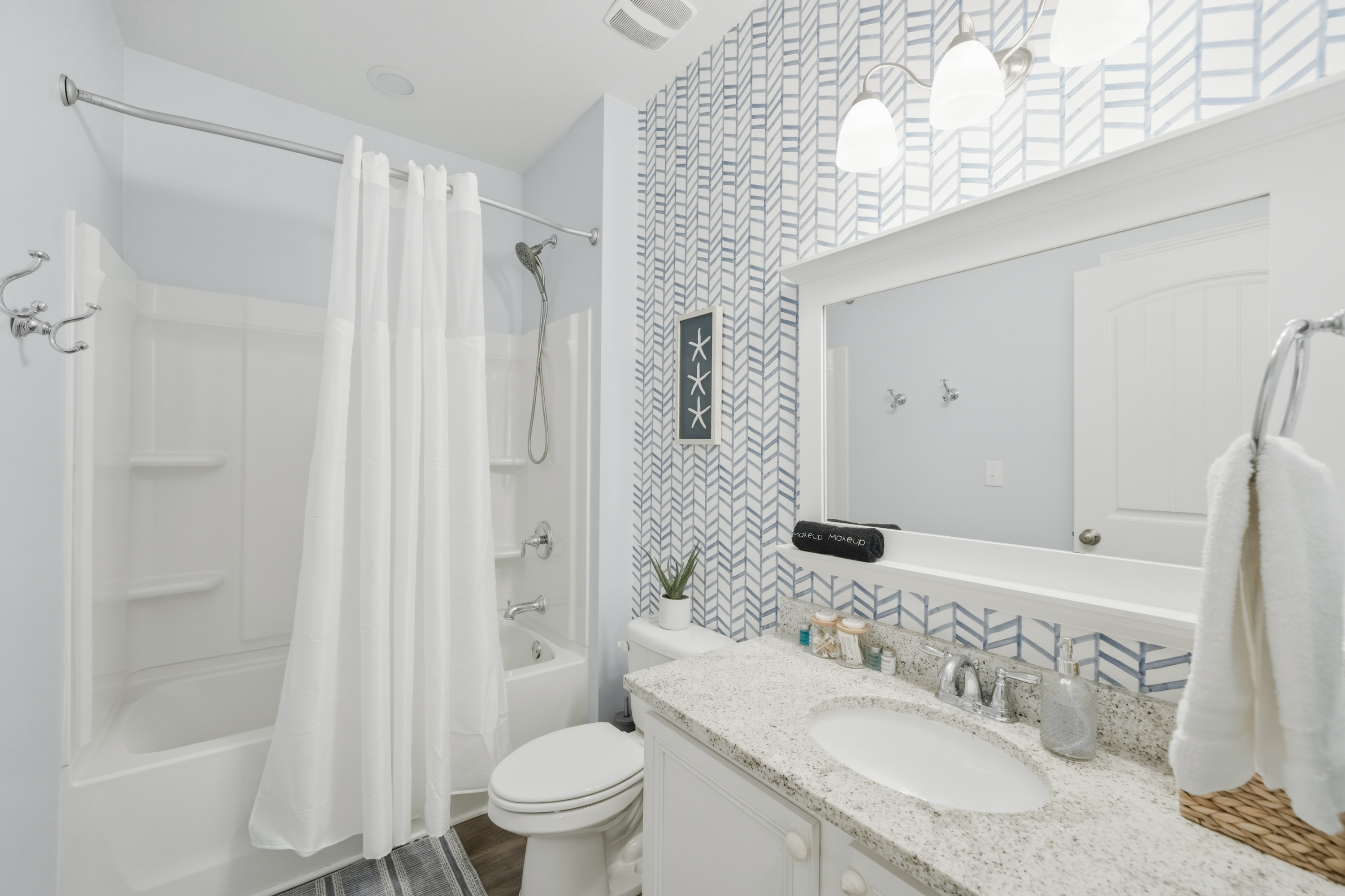 Full bathroom beside the bunk room with stylish finishes, a spacious vanity, and everything you need for a comfortable stay