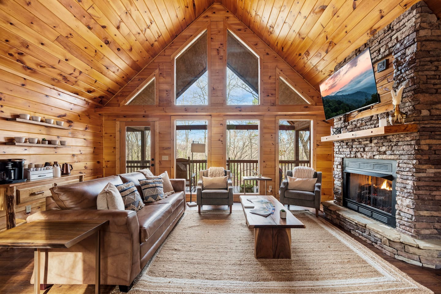 Living room with sleeper sofa, fireplace and beautiful deck.