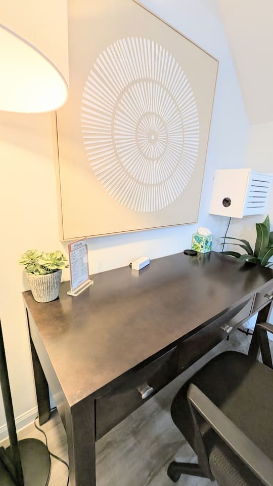 Large desk space with easily accessible charging for your laptop or devices. 