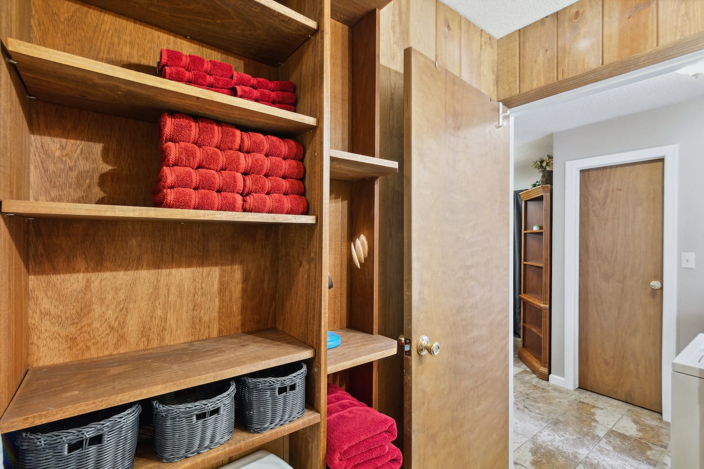 8 bath towels, hand towels and wash cloths provided. Custom built-in shelving offer extra storage for longer stays. More storage available under sink and in drawer.