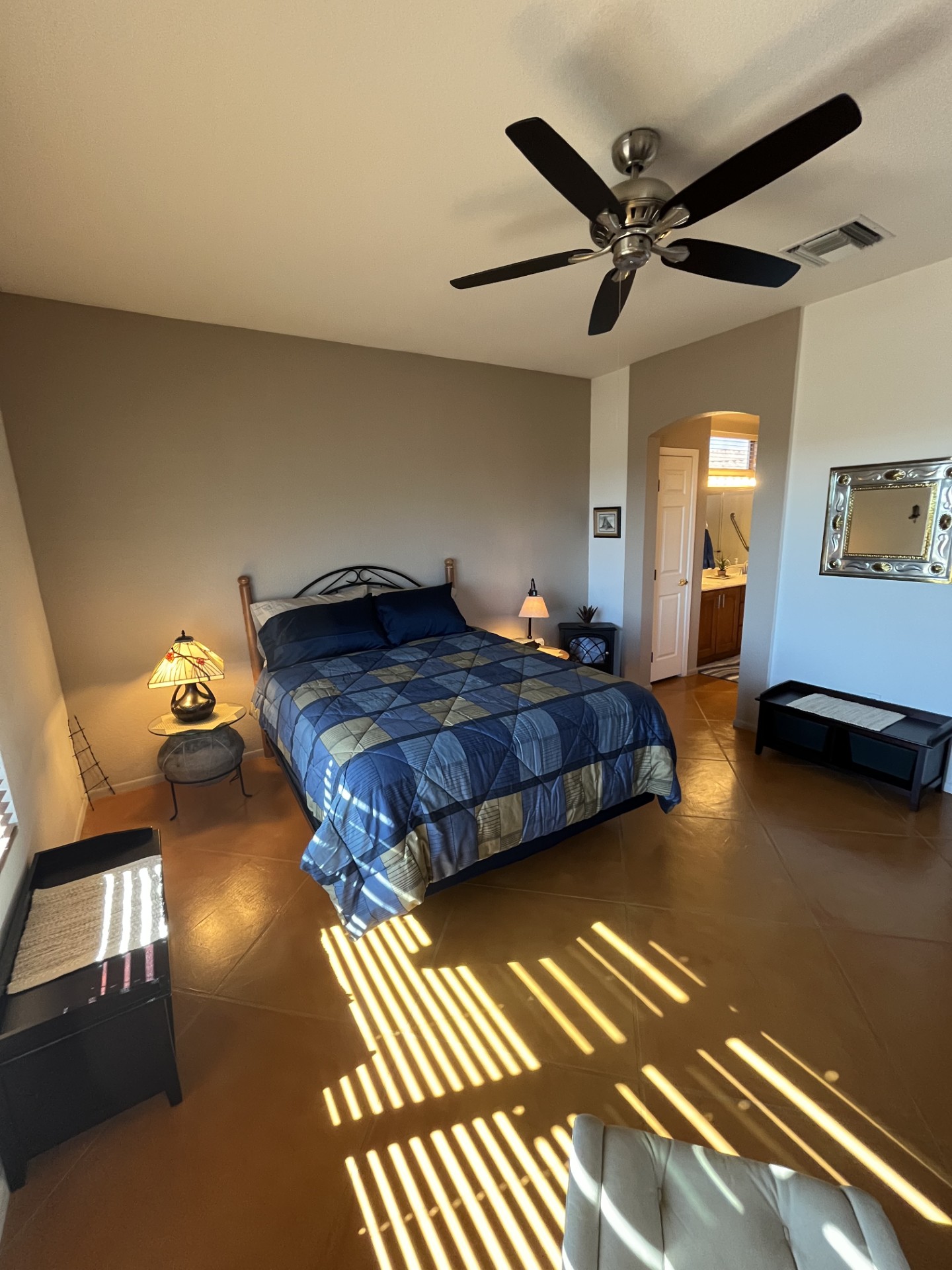Primary suite bedroom offers a queen bed