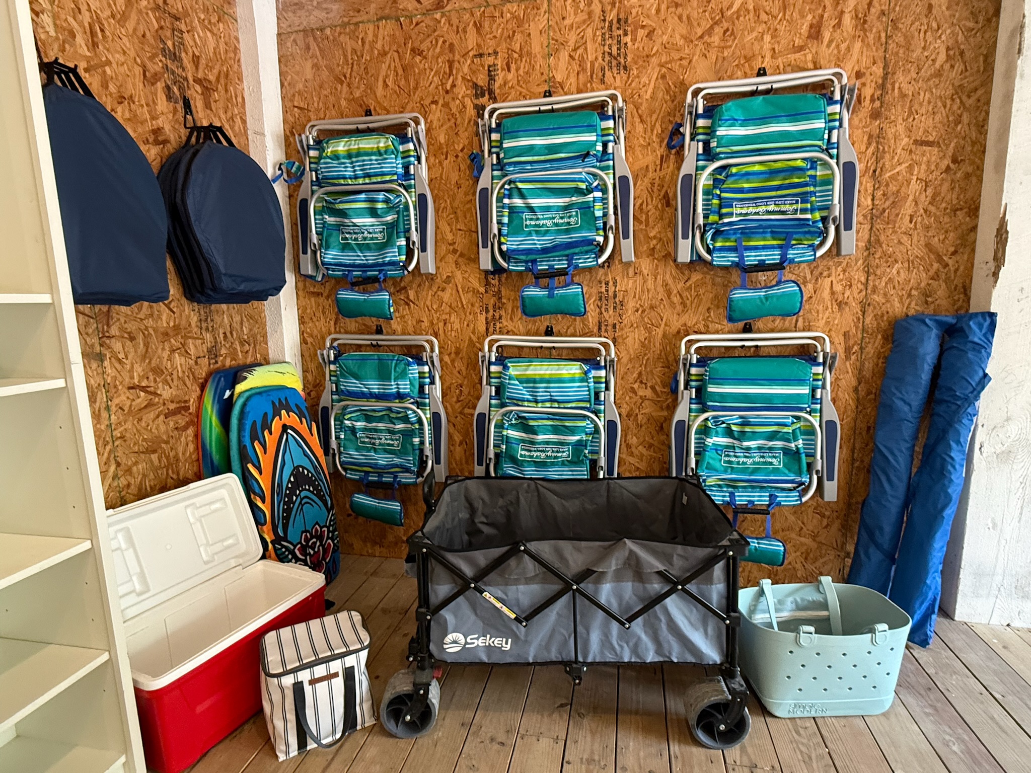 6 Tommy Bahama beach chairs, 2 umbrellas, coolers, a beach wagon and a beach bag