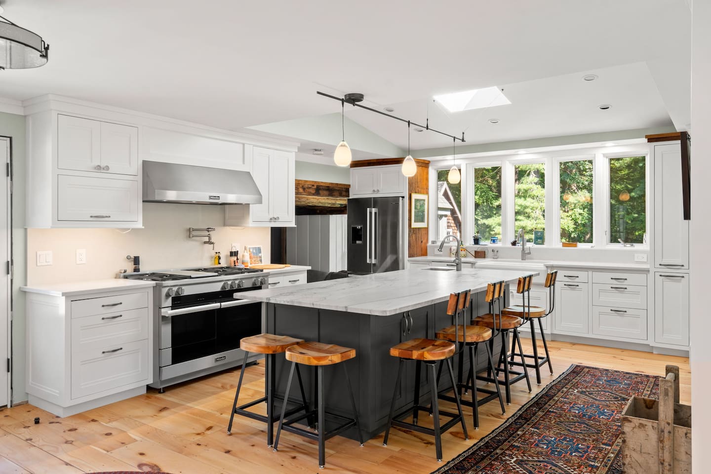 Kitchen with 60 inch professional gas range and 3 ovens