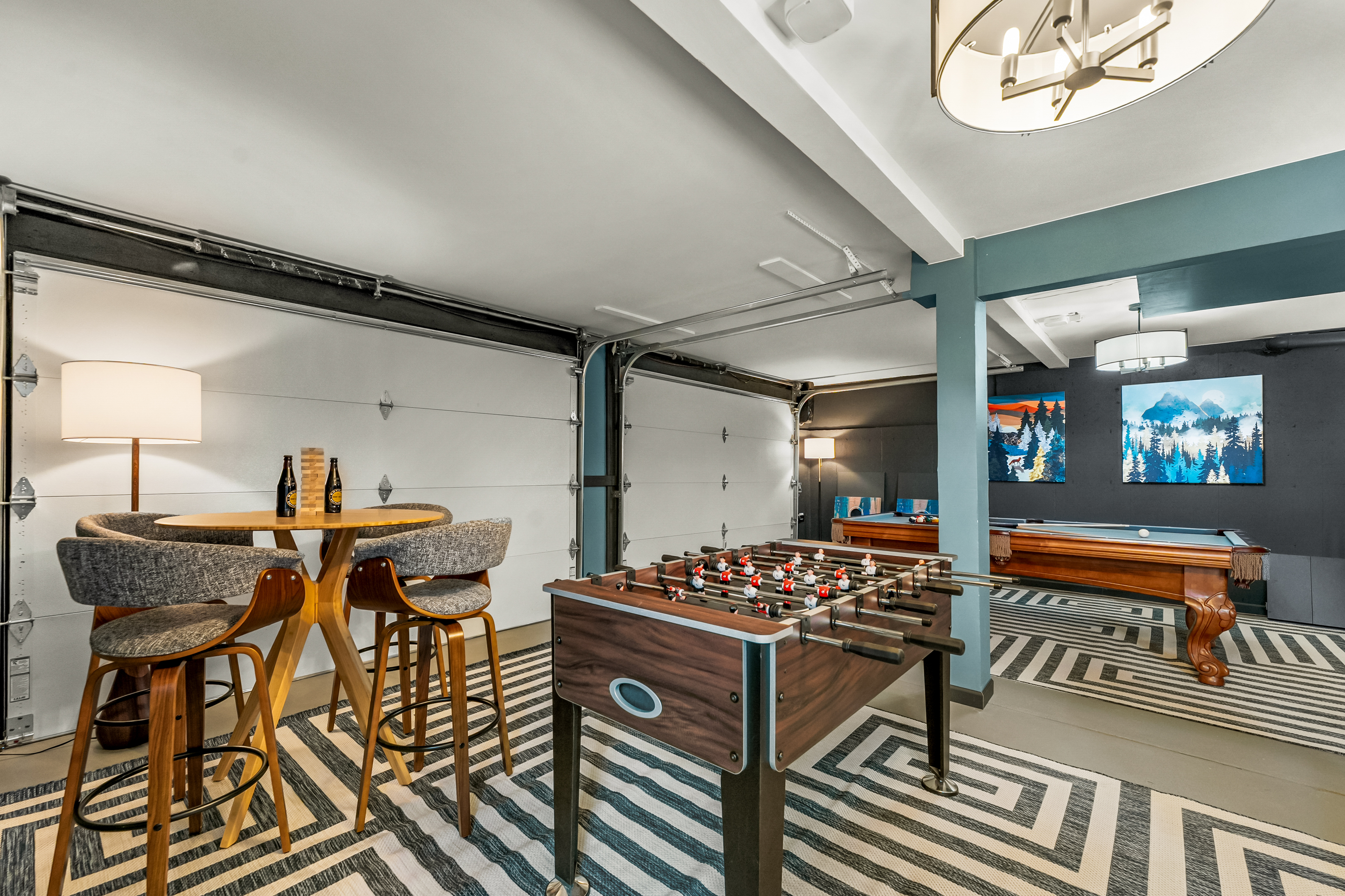 🎱 Game room vibes: shoot pool, challenge friends at foosball ⚽️, and kick back at the bar table 🍻—all in a bright, spacious hangout with cozy rugs & mountain art.