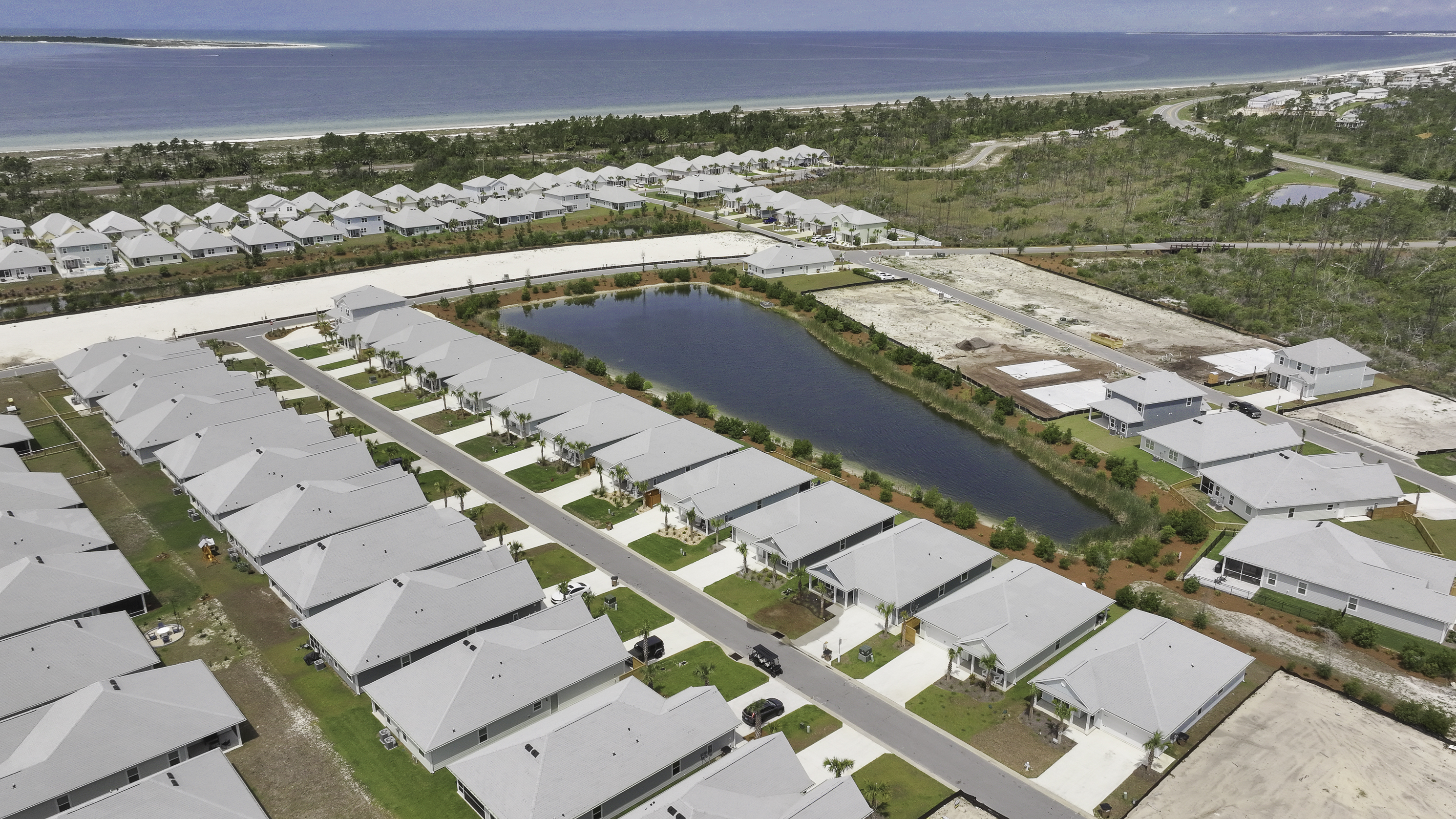 Scenic aerial shot of the home within few min golf cart distance to pool and beach areas
