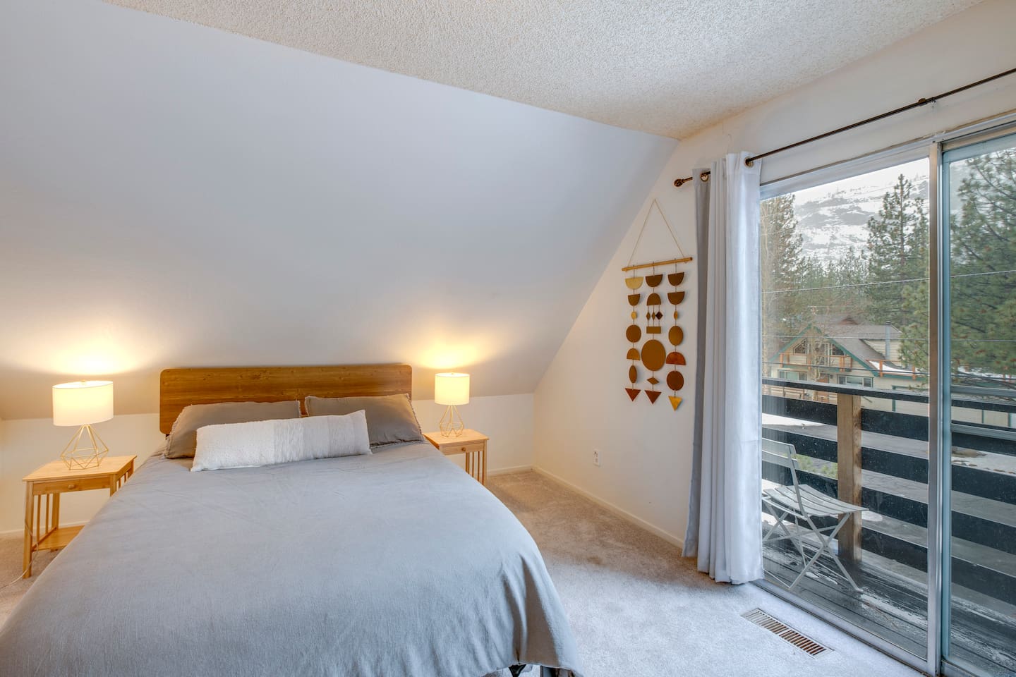 Upstairs bedroom with an attached balcony