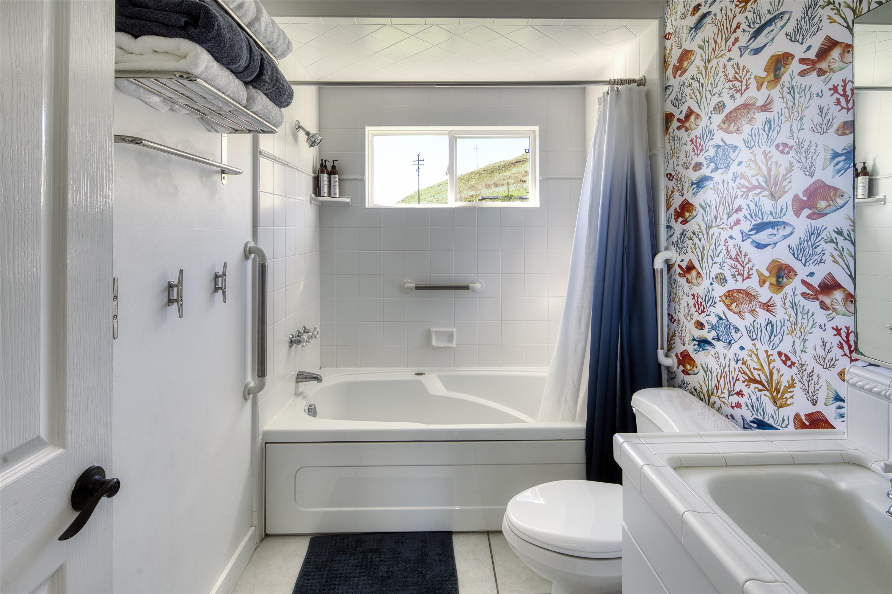 Clean, bright, and fully stocked — a comfy bathroom with everything your family needs.