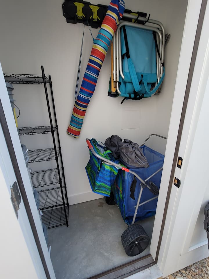 Chairs, cart, umbrella and additional beach gear storage for your use!