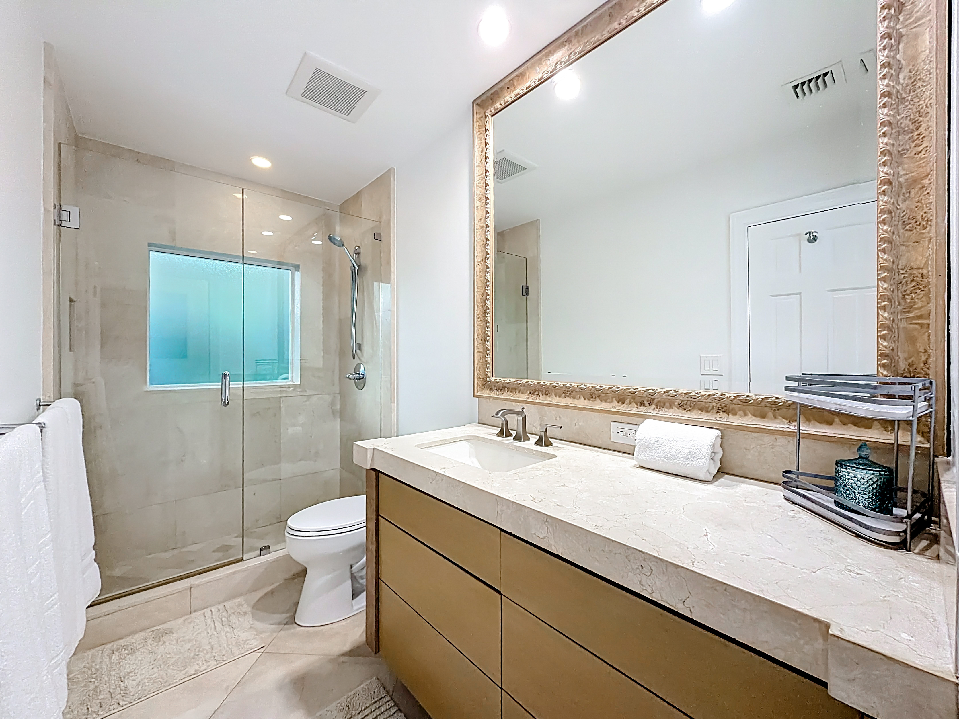 Nice marble bathroom between bedroom 2 and bedroom 3. 