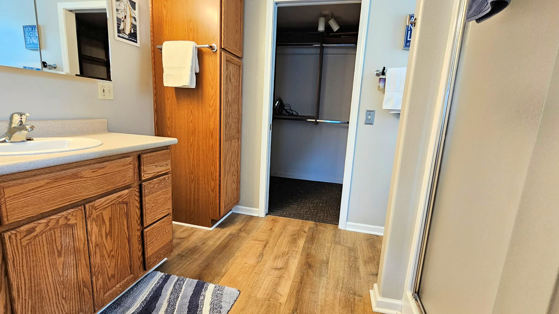 ensuite bath with walk in shower and walk in closet