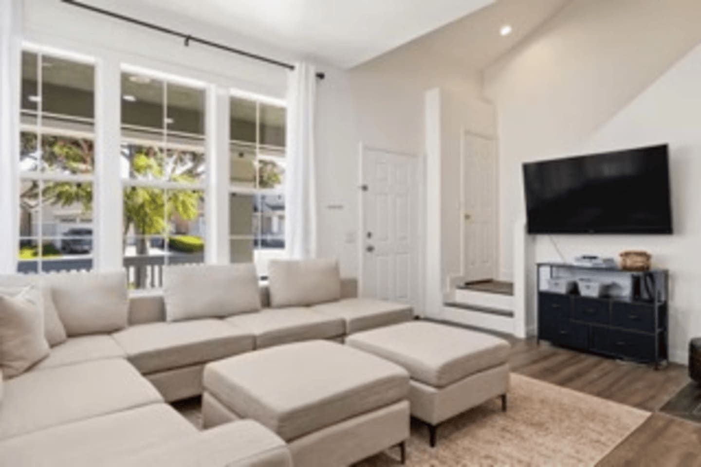 Cozy living space featuring a Smart TV, gas fireplace with fire screen, comfortable sectional seating, and fast WiFi for relaxing movie nights.