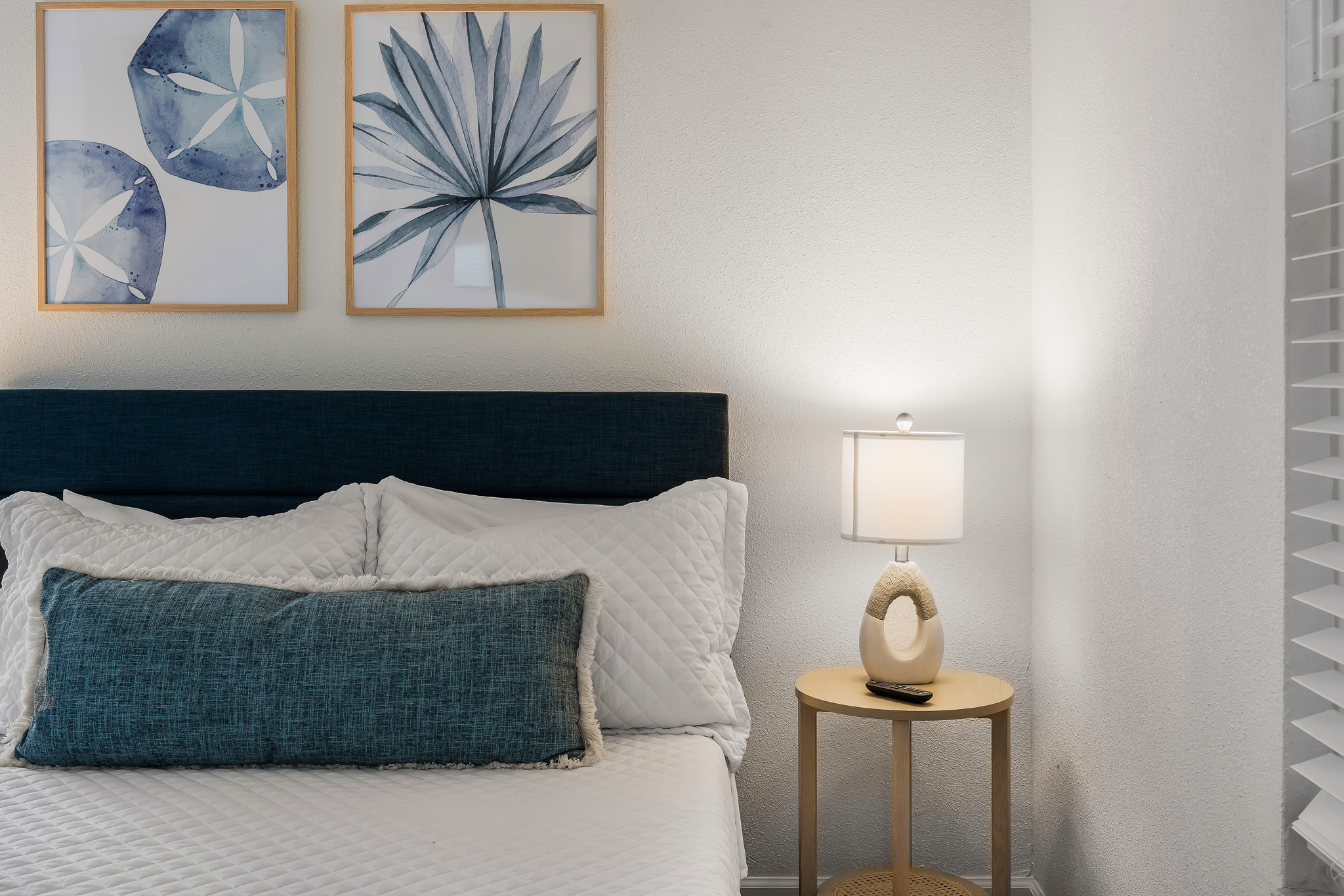 Relax and unwind in this inviting queen bedroom, complete with a 40” smart TV for streaming, convenient bedside tables, and a three-drawer dresser for your belongings. (No closet in this room.)