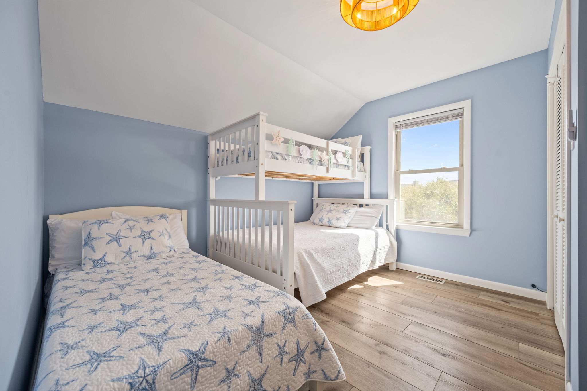 Perfect for families or groups, this bunk room features a twin-over-full bunk and an extra twin bed, offering comfort and flexibility for everyone.