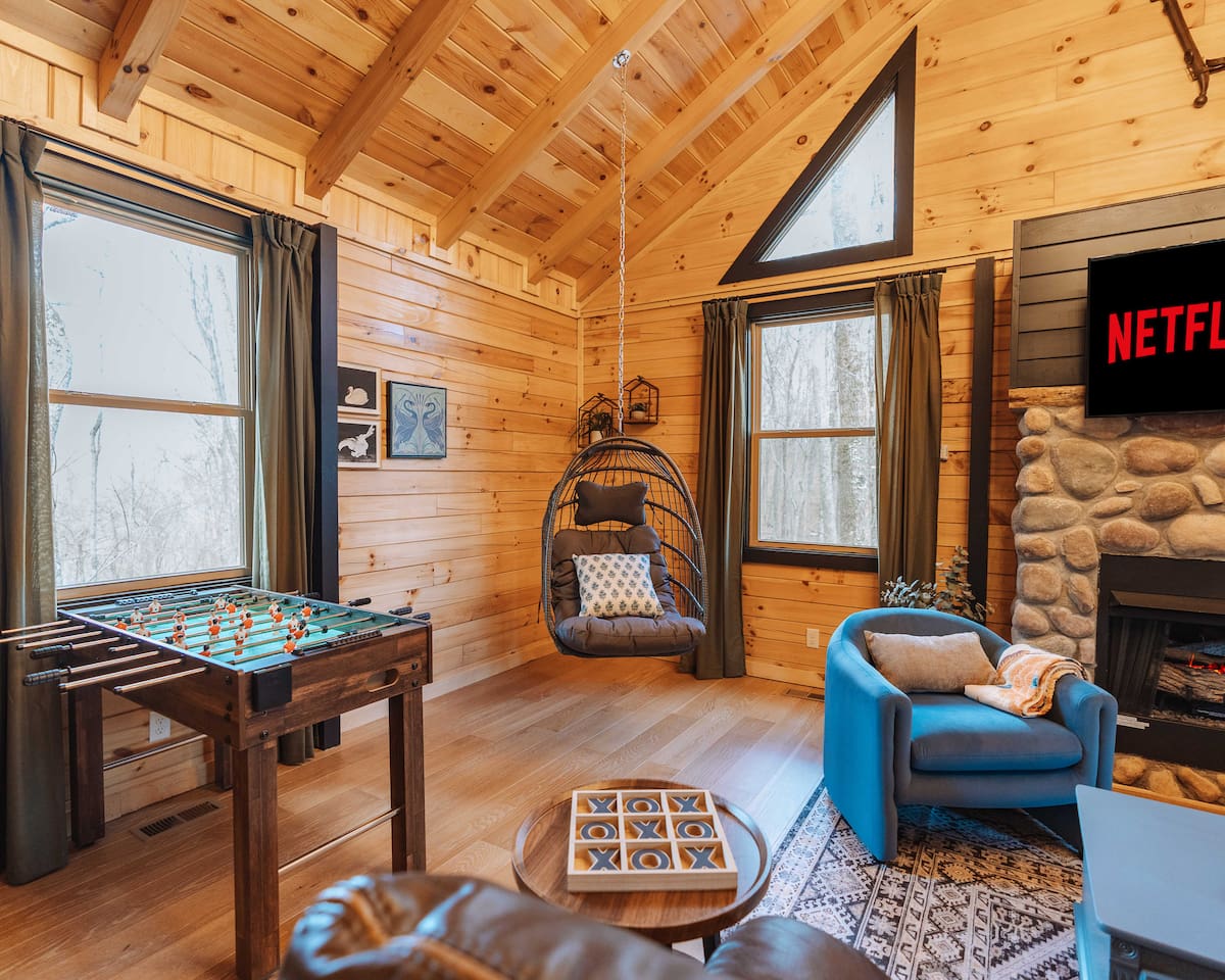 Coz living room with a swing and fooseball to relax and enjoy!