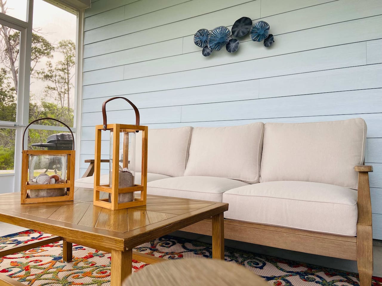 Plush cushions on the back porch make morning coffee comfortable and relaxing